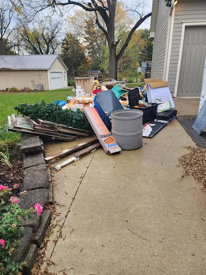 Dumpster being loaded with debris for Residential Dumpster Rental in West Ocean City